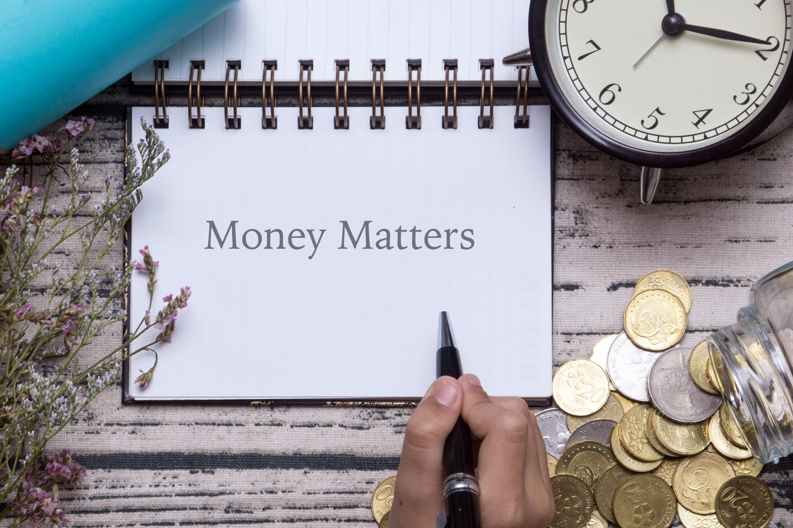 Financial,Conceptual,Image.,Coins,Spill,,Pen,,Notebook,And,Clock,On