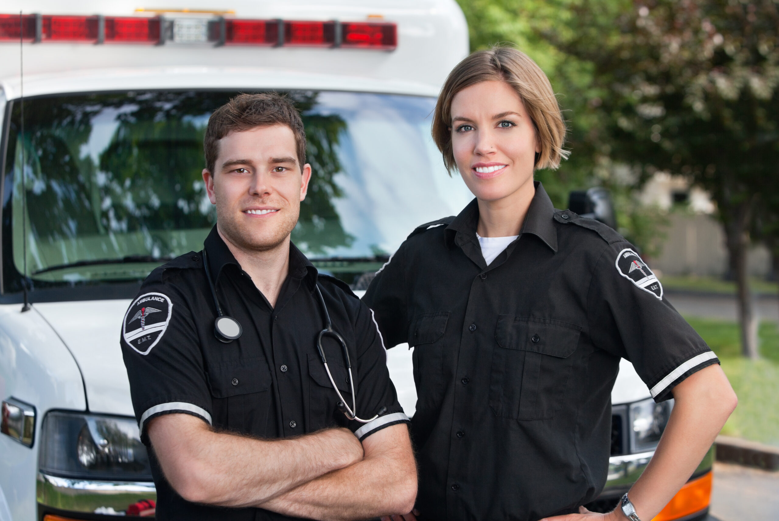 Paramedic,Team,Portrait,Standing,In,Front,Of,Ambulance